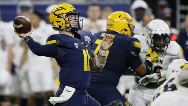 DETROIT, MI - DECEMBER 02: Quarterback Logan Woodside #11 of the Toledo Rockets passes the ball against Akron during the first half at Ford Field on December 2, 2017 in Detroit, Michigan.