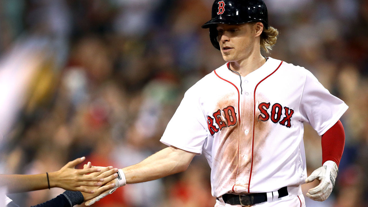 BOSTON, MA - JULY 18: Brock Holt #12 of the Boston Red Sox celebrates with fans after scoring a run against the Toronto Blue Jays during the seventh inning at Fenway Park on July 18, 2017 in Boston, Massachusetts.