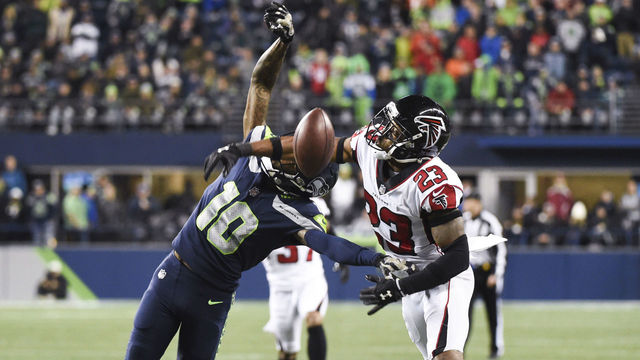 SEATTLE, WA - NOVEMBER 20: Cornerback Robert Alford #23 of the Atlanta Falcons gets called for pass interference on wide receiver Paul Richardson #10 of the Seattle Seahawks during the third quarter of the game at CenturyLink Field on November 20, 2017 in Seattle, Washington.