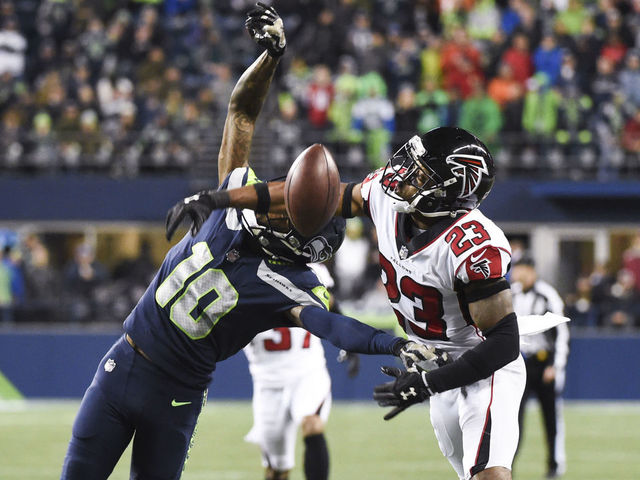SEATTLE, WA - NOVEMBER 20: Cornerback Robert Alford #23 of the Atlanta Falcons gets called for pass interference on wide receiver Paul Richardson #10 of the Seattle Seahawks during the third quarter of the game at CenturyLink Field on November 20, 2017 in Seattle, Washington.