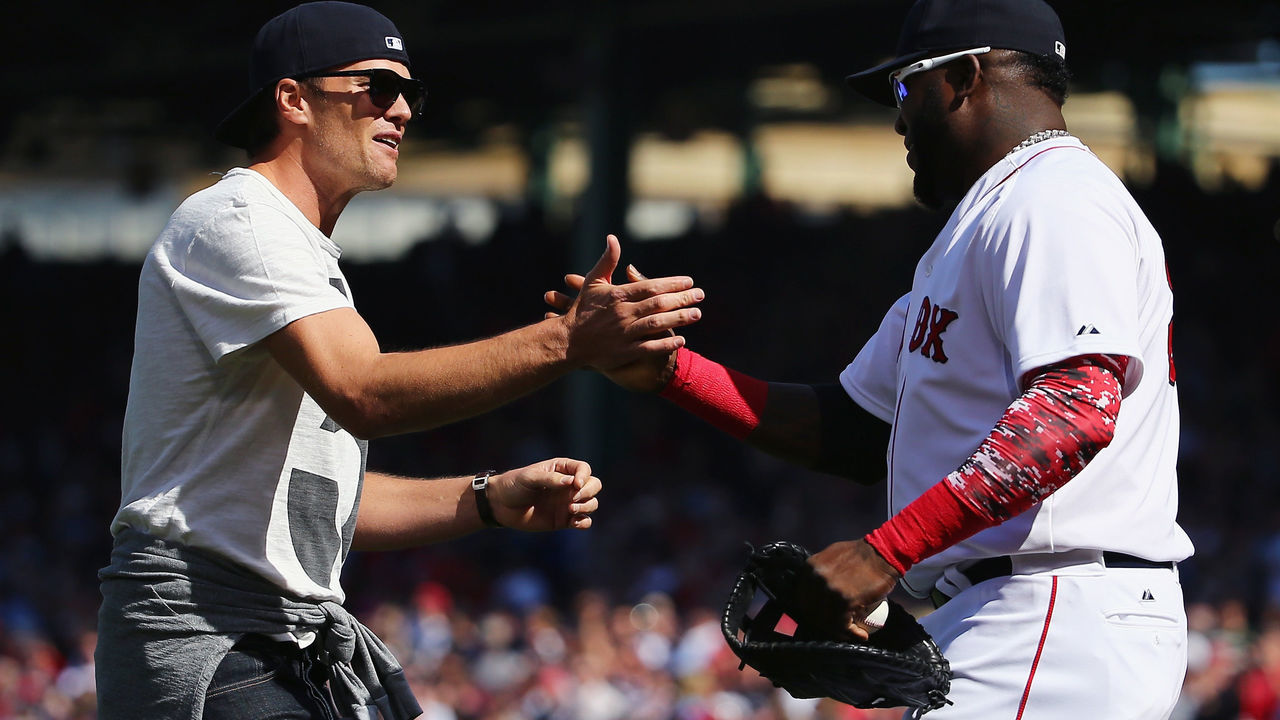 BOSTON, MA - APRIL 13: New England Patriots quarterback Tom Brady talks with David Ortiz #34 of the Boston Red Sox after throwing out the first pitch before the game against the Washington Nationals at Fenway Park on April 13, 2015 in Boston, Massachusetts.