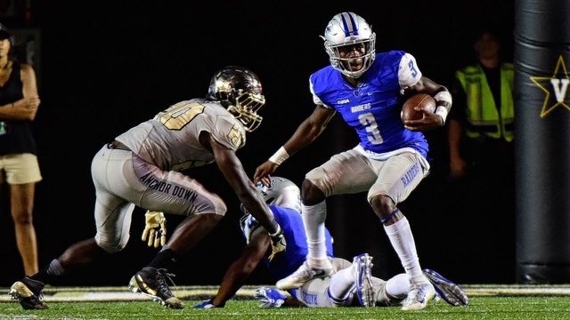 NASHVILLE, TN - SEPTEMBER 10: Richie James #3 of the Middle Tennessee State Blue Raiders rushes against Oren Burks #20 of the Vanderbilt Commodores during the second half at Vanderbilt Stadium on September 10, 2016 in Nashville, Tennessee.