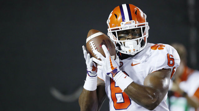 LOUISVILLE, KY - SEPTEMBER 16: Dorian O'Daniel #6 of the Clemson Tigers holds the ball up to his ear after returning an interception 44 yards for a touchdown in the third quarter of a game against the Louisville Cardinals at Papa John's Cardinal Stadium on September 16, 2017 in Louisville, Kentucky. Clemson won 47-21.
