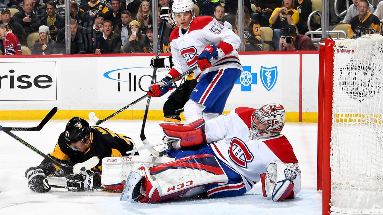 PITTSBURGH, PA - MARCH 21: Evgeni Malkin #71 of the Pittsburgh Penguins scores past Carey Price #31 of the Montreal Canadiens at PPG Paints Arena on March 21, 2018 in Pittsburgh, Pennsylvania.
