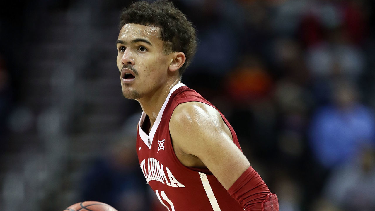 KANSAS CITY, MO - MARCH 07: Trae Young #11 of the Oklahoma Sooners controls the ball during the first round of the Big 12 Basketball Tournament against the Oklahoma State Cowboys at the Sprint Center on March 7, 2018 in Kansas City, Missouri.
