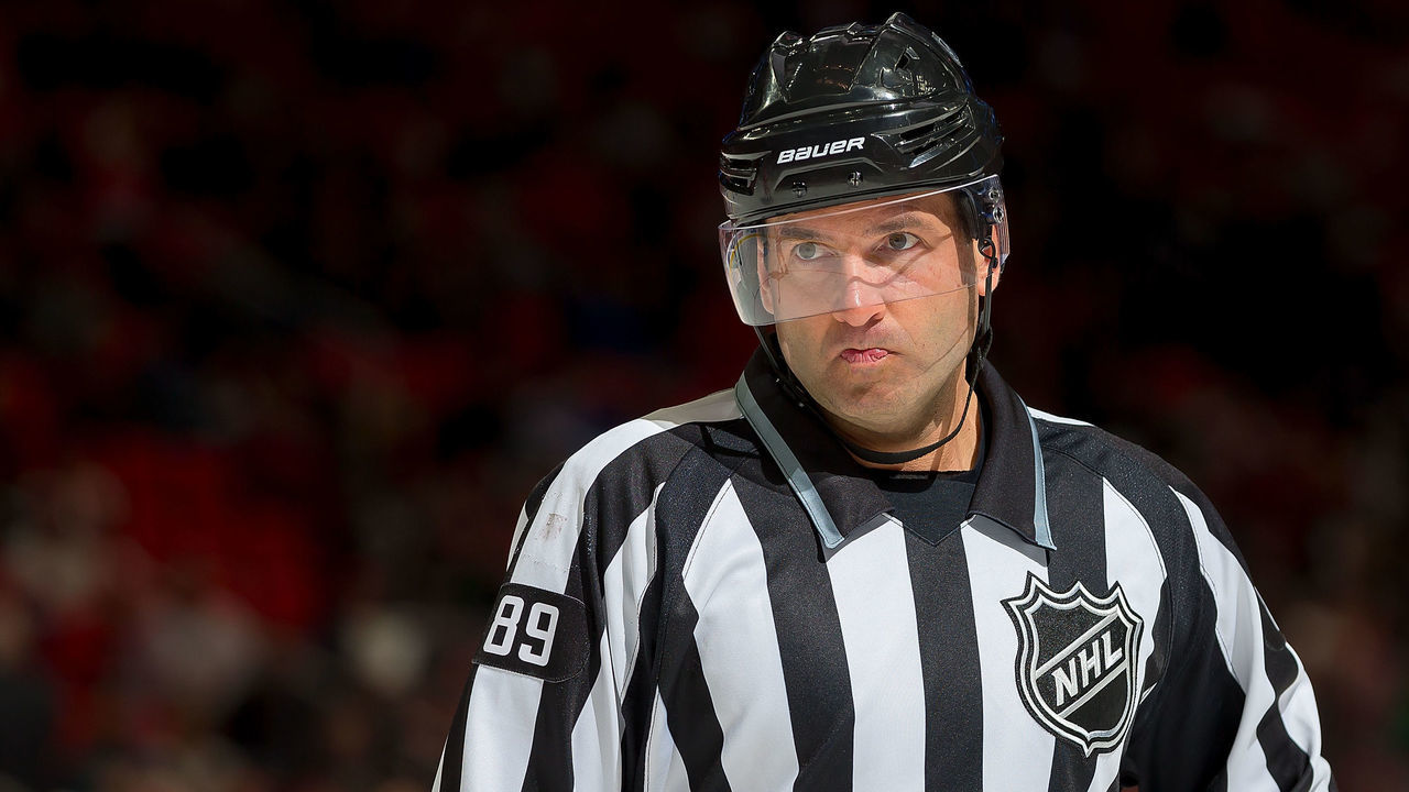 DETROIT, MI - MARCH 20: Linesman Steve Miller #89 looks down the ice during an NHL game between the Detroit Red Wings and the Philadelphia Flyers at Little Caesars Arena on March 20, 2018 in Detroit, Michigan. The Wings defeated the Flyers 5-4 in a shootout.