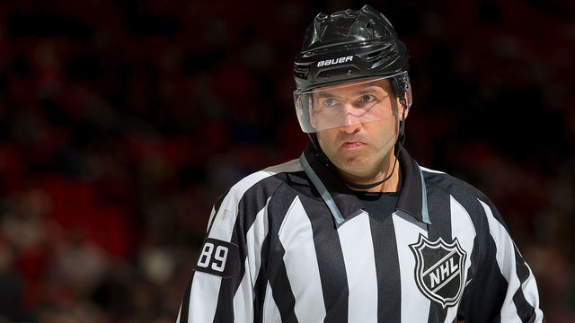 DETROIT, MI - MARCH 20: Linesman Steve Miller #89 looks down the ice during an NHL game between the Detroit Red Wings and the Philadelphia Flyers at Little Caesars Arena on March 20, 2018 in Detroit, Michigan. The Wings defeated the Flyers 5-4 in a shootout.