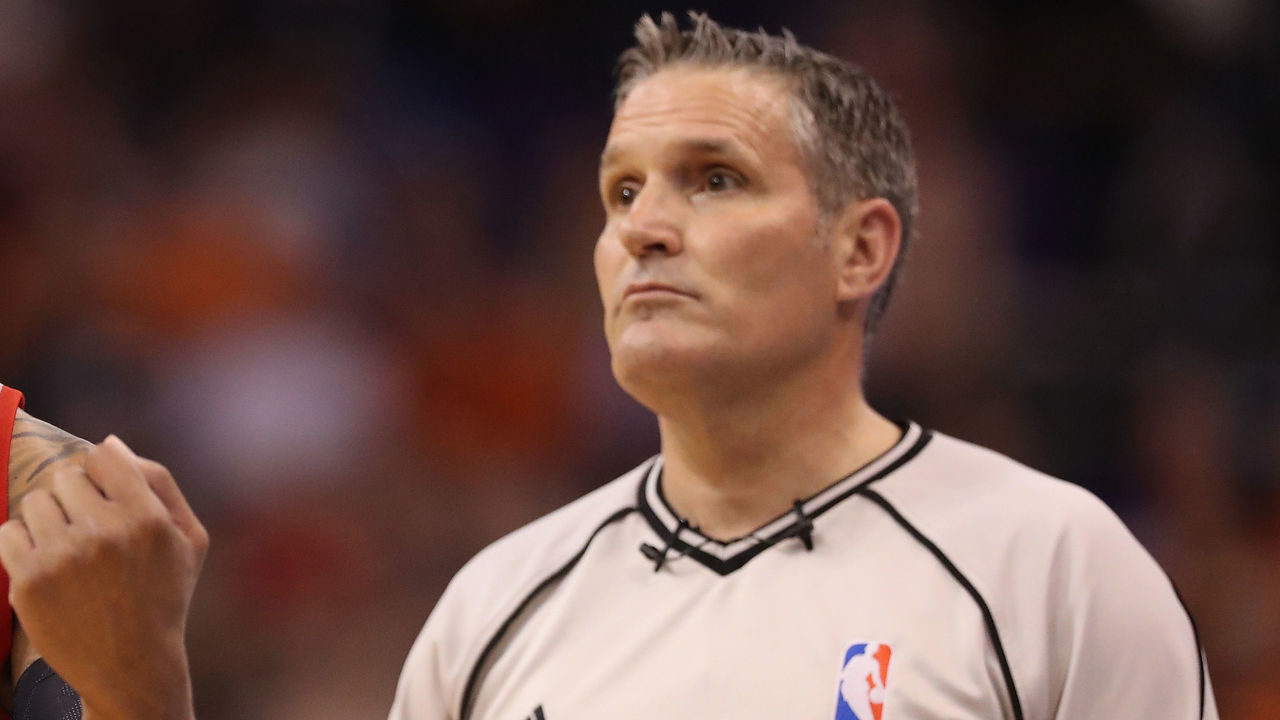 PHOENIX, AZ - MARCH 12: Damian Lillard #0 of the Portland Trail Blazers talks with referee Monty McCutchen #13 during the first half of the NBA game against the Phoenix Suns at Talking Stick Resort Arena on March 12, 2017 in Phoenix, Arizona.