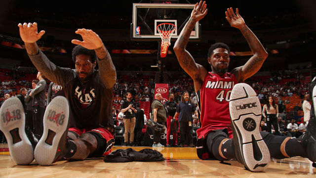 MIAMI, FL - MARCH 21: James Johnson #16 and Udonis Haslem #40 of the Miami Heat stretch prior to the game against the New York Knicks on March 21, 2018 at American Airlines Arena in Miami, Florida. Mandatory Copyright Notice: Copyright 2018 NBAE