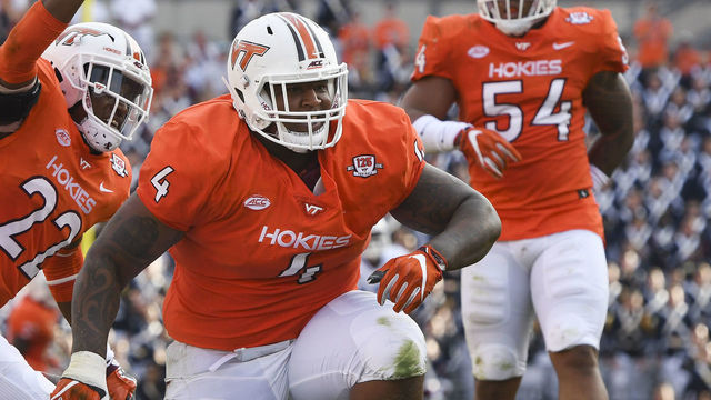 BLACKSBURG, VA - OCTOBER 21: Defensive tackle Tim Settle #4 and safety Terrell Edmunds #22 of the Virginia Tech Hokies celebrate their sack on quarterback Brandon Harris #6 of the North Carolina Tar Heels in the first half at Lane Stadium on October 21, 2017 in Blacksburg, Virginia.