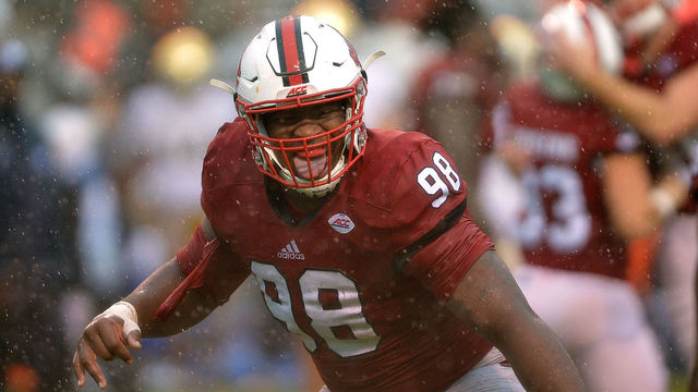 RALEIGH, NC - OCTOBER 08: B.J. Hill #98 of the North Carolina State Wolfpack celebrates after a win against the Notre Dame Fighting Irish at Carter Finley Stadium on October 8, 2016 in Raleigh, North Carolina. North Carolina State won 10-3.