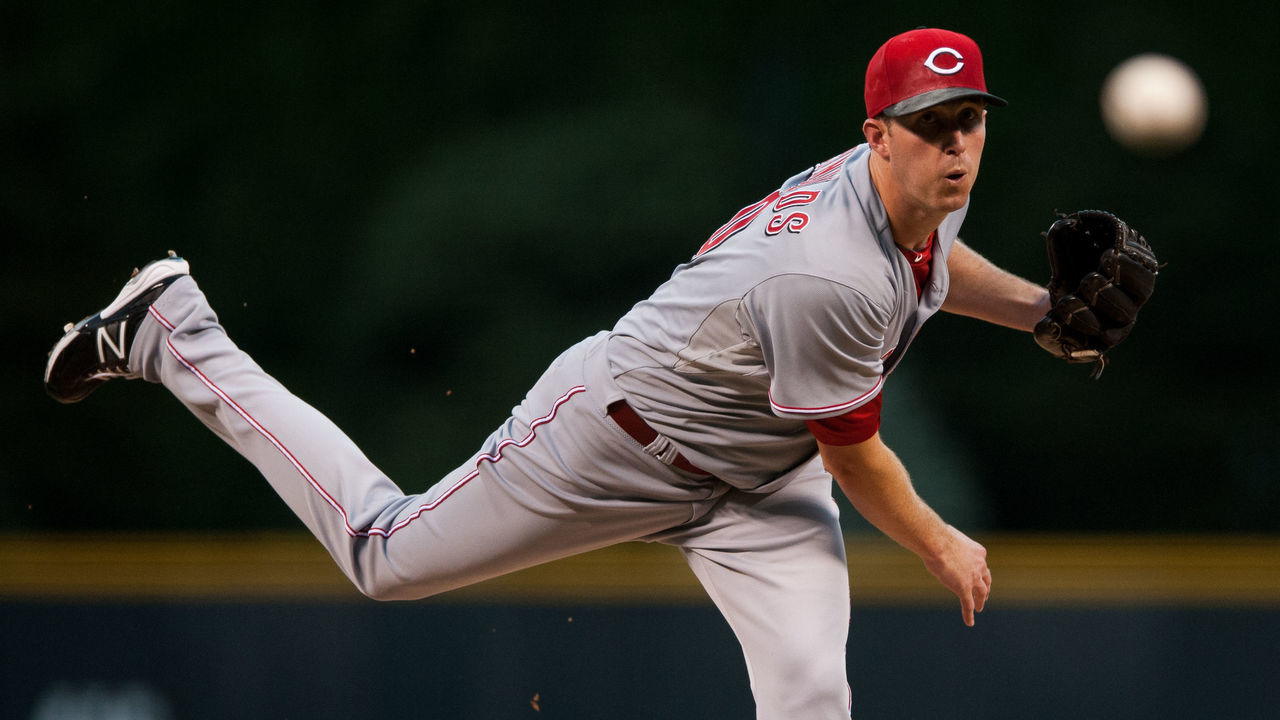 DENVER, CO - AUGUST 31: Greg Reynolds #40 of the Cincinnati Reds pitches against the Colorado Rockies in the first inning of a game at Coors Field on August 31, 2013 in Denver, Colorado.
