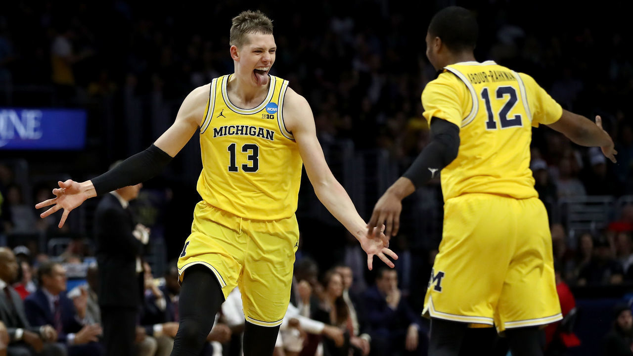 LOS ANGELES, CA - MARCH 22: Moritz Wagner #13 celebrates with Muhammad-Ali Abdur-Rahkman #12 of the Michigan Wolverines after Wagner makes a three-pointer in the first half against the Texas A&M Aggies in the 2018 NCAA Men's Basketball Tournament West Regional at Staples Center on March 22, 2018 in Los Angeles, California.