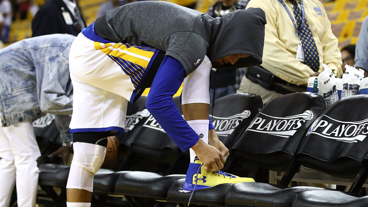 OAKLAND, CA - MAY 02: Stephen Curry #30 of the Golden State Warriors laces up his shoes during warmups prior to Game One of the NBA Western Conference Semi-Finals against the Utah Jazz at ORACLE Arena on May 2, 2017 in Oakland, California.