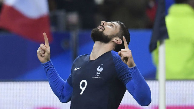 France's forward Olivier Giroud celebrates after scoring a goal during the friendly football match between France and Colombia at the Stade de France, in Saint-Denis, on the outskirts of Paris, on March 23, 2018. / AFP PHOTO / CHRISTOPHE SIMON