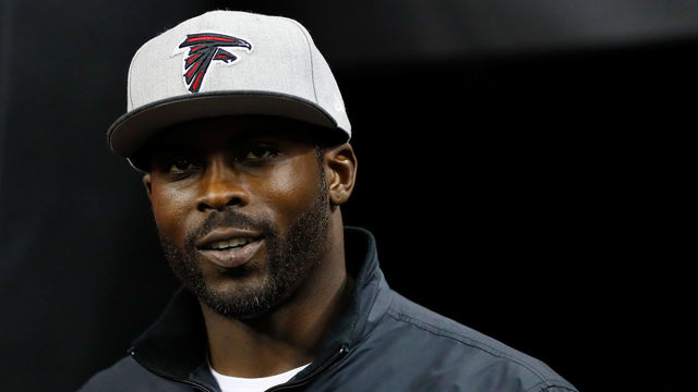 ATLANTA, GA - JANUARY 01: Former Atlanta Falcons player Michael Vick walks on the field prior to the game against the New Orleans Saints at the Georgia Dome on January 1, 2017 in Atlanta, Georgia.
