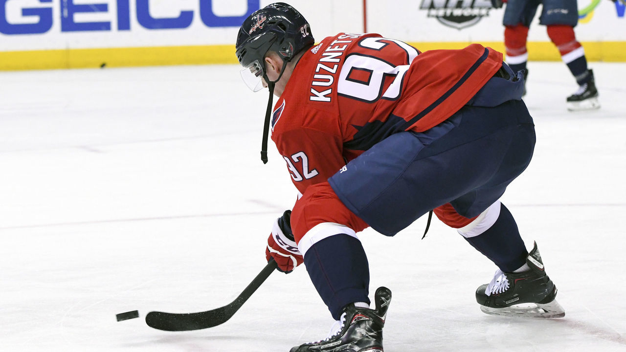 WASHINGTON, DC - MARCH 12: Washington Capitals center Evgeny Kuznetsov (92) warms up with a broken stick on March 12, 2018, at the Capital One Arena in Washington, D.C. The Washington Capitals defeated the Winnipeg Jets, 3-2 in overtime.