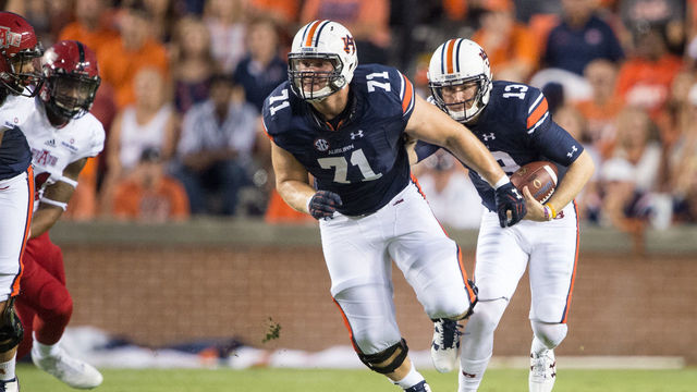 AUBURN, AL - SEPTEMBER 10: Quarterback Sean White #13 of the Auburn Tigers carries the ball behind offensive lineman Braden Smith #71 of the Auburn Tigers during their game against the Arkansas State Red Wolves at Jordan Hare Stadium on September 10, 2016 in Auburn, Alabama.