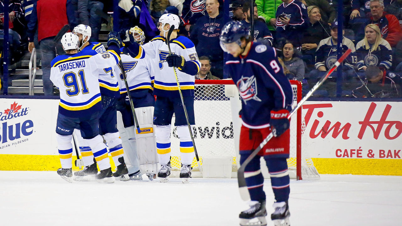 COLUMBUS, OH - MARCH 24: Artemi Panarin #9 of the Columbus Blue Jackets skates off the ice as Colton Parayko #55 of the St. Louis Blues and Vladimir Tarasenko #91 of the St. Louis Blues congratulate each other after defeating the Columbus Blue Jackets 2-1 on March 24, 2018 at Nationwide Arena in Columbus, Ohio.