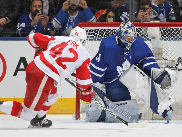 TORONTO, ON - MARCH 24: Martin Frk #42 of the Detroit Red Wings is stopped on a penalty shop against Frederik Andersen #31 of the Toronto Maple Leafs during an NHL game at the Air Canada Centre on March 24, 2018 in Toronto, Ontario, Canada.