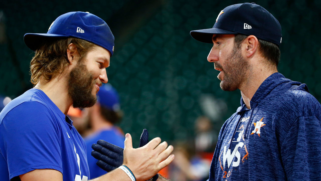 HOUSTON, TX - OCTOBER 27: Clayton Kershaw #22 of the Los Angeles Dodgers shakes hands with Justin Verlander #35 of the Houston Astros before game three of the 2017 World Series at Minute Maid Park on October 27, 2017 in Houston, Texas.