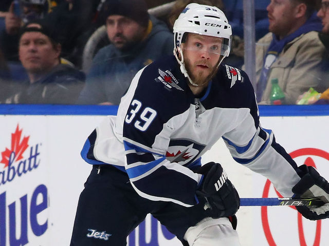 BUFFALO, NY - JANUARY 9: Toby Enstrom #39 of the Winnipeg Jets in play against the Buffalo Sabres at the KeyBank Center on January 9, 2018 in Buffalo, New York. The Jets beat the Sabres 7-4.