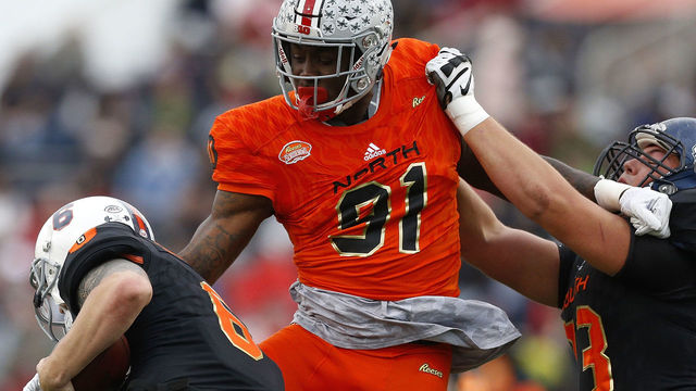 MOBILE, AL - JANUARY 27: Kurt Benkert #6 of the South team is sacked by Jalyn Holmes #91 of the North team during the first half of the Reese's Senior Bowl at Ladd-Peebles Stadium on January 27, 2018 in Mobile, Alabama.