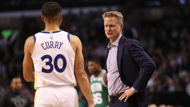 BOSTON, MA - NOVEMBER 16: Steve Kerr of the Golden State Warriors talks with Stephen Curry #30 during the first quarter against the Boston Celtics at TD Garden on November 16, 2017 in Boston, Massachusetts.