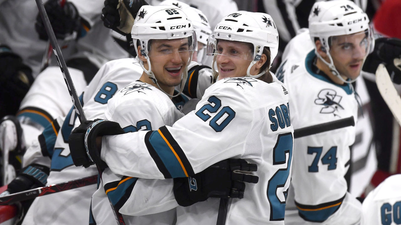 CHICAGO, IL - MARCH 26: San Jose Sharks right wing Kevin Labanc (62) celebrates with San Jose Sharks left wing Marcus Sorensen (20) and teammates after scoring the winning goal during a penalty shoot-out in overtime play during a game between the Chicago Blackhawks and the San Jose Sharks on March 26, 2018, at the United Center in Chicago, Illinois.