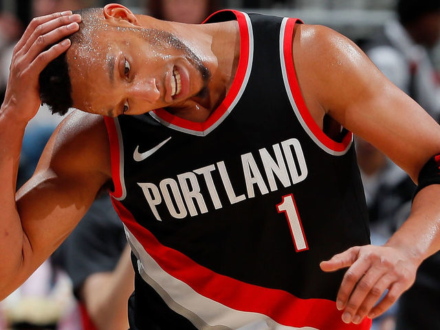 ATLANTA, GA - DECEMBER 30: Evan Turner #1 of the Portland Trail Blazers pulls down on his head as he runs down the court against the Atlanta Hawks at Philips Arena on December 30, 2017 in Atlanta, Georgia.