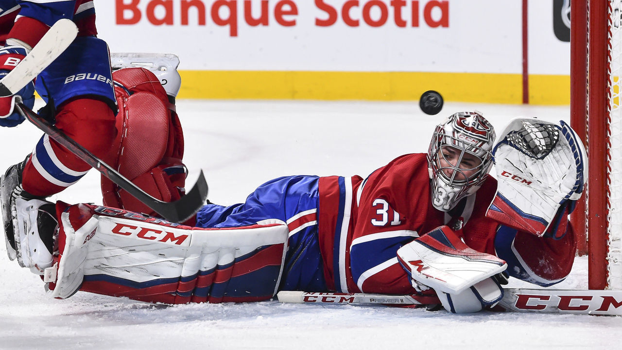 MONTREAL, QC - FEBRUARY 10: Goaltender Carey Price #31 of the Montreal Canadiens loses sight of the puck as he gets the glove up against the Nashville Predators during the NHL game at the Bell Centre on February 10, 2018 in Montreal, Quebec, Canada. The Nashville Predators defeated the Montreal Canadiens 3-2 in a shootout.