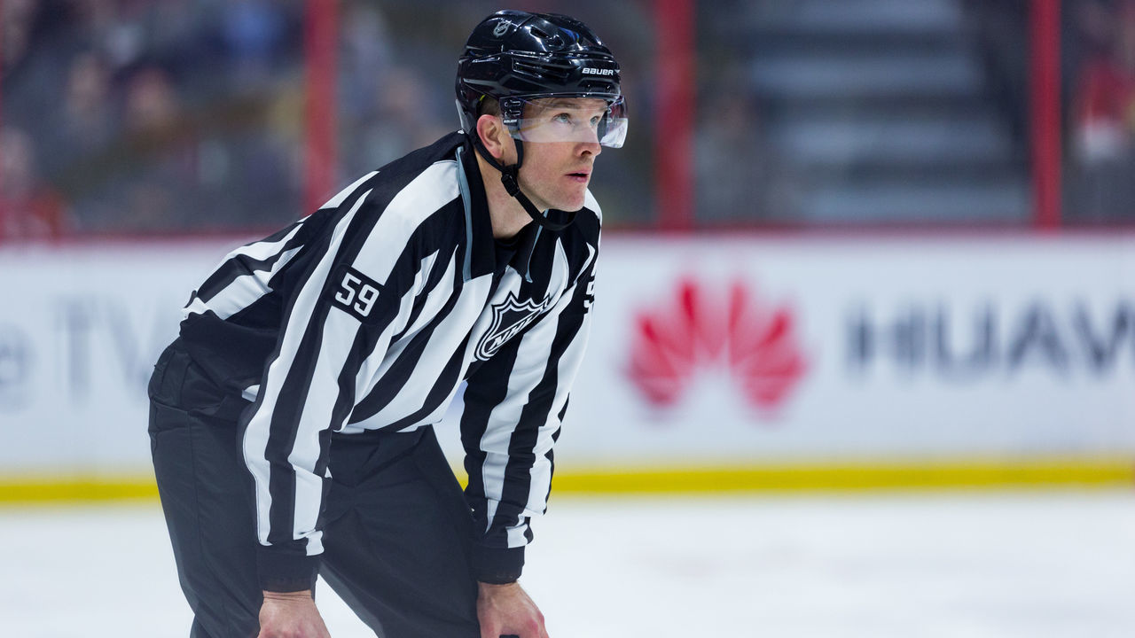 OTTAWA, ON - MARCH 20: Linesmen Steve Barton (59) prepares for a face-off during third period National Hockey League action between the Florida Panthers and Ottawa Senators on March 20, 2018, at Canadian Tire Centre in Ottawa, ON, Canada.