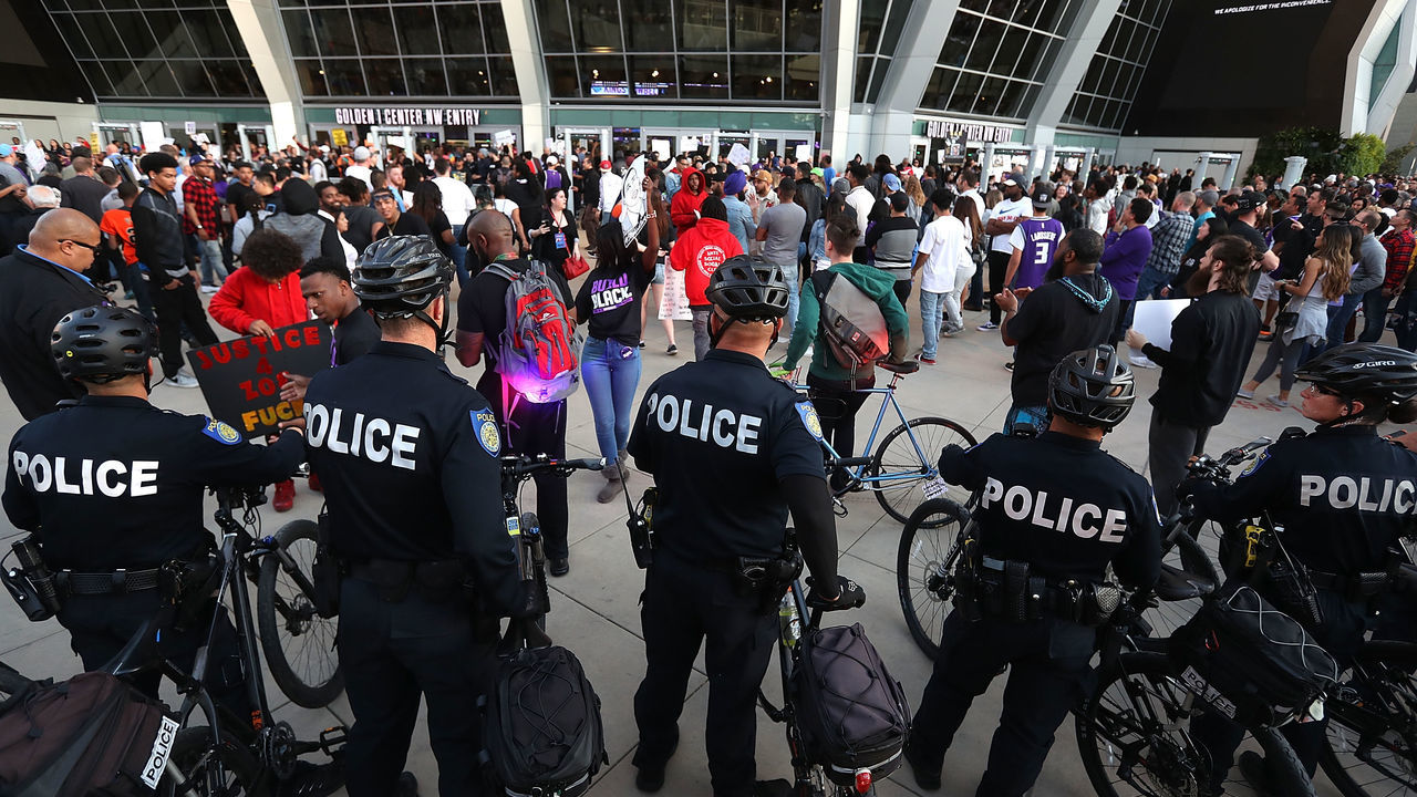 SACRAMENTO, CA - MARCH 27: Sacramento police monitor a Black Live Matter protest outisde of the Golden 1 Center where the Sacramento Kings are playing on March 27, 2018 in Sacramento, California. Black Lives Matter protesters took to the streets as hundreds packed a special city council at Sacramento City Hall to address concerns over the shooting death of Stephon Clark by Sacramento police.