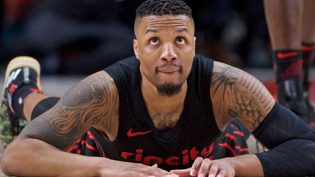 Lillard returns day after son is born, half-brother is shot
