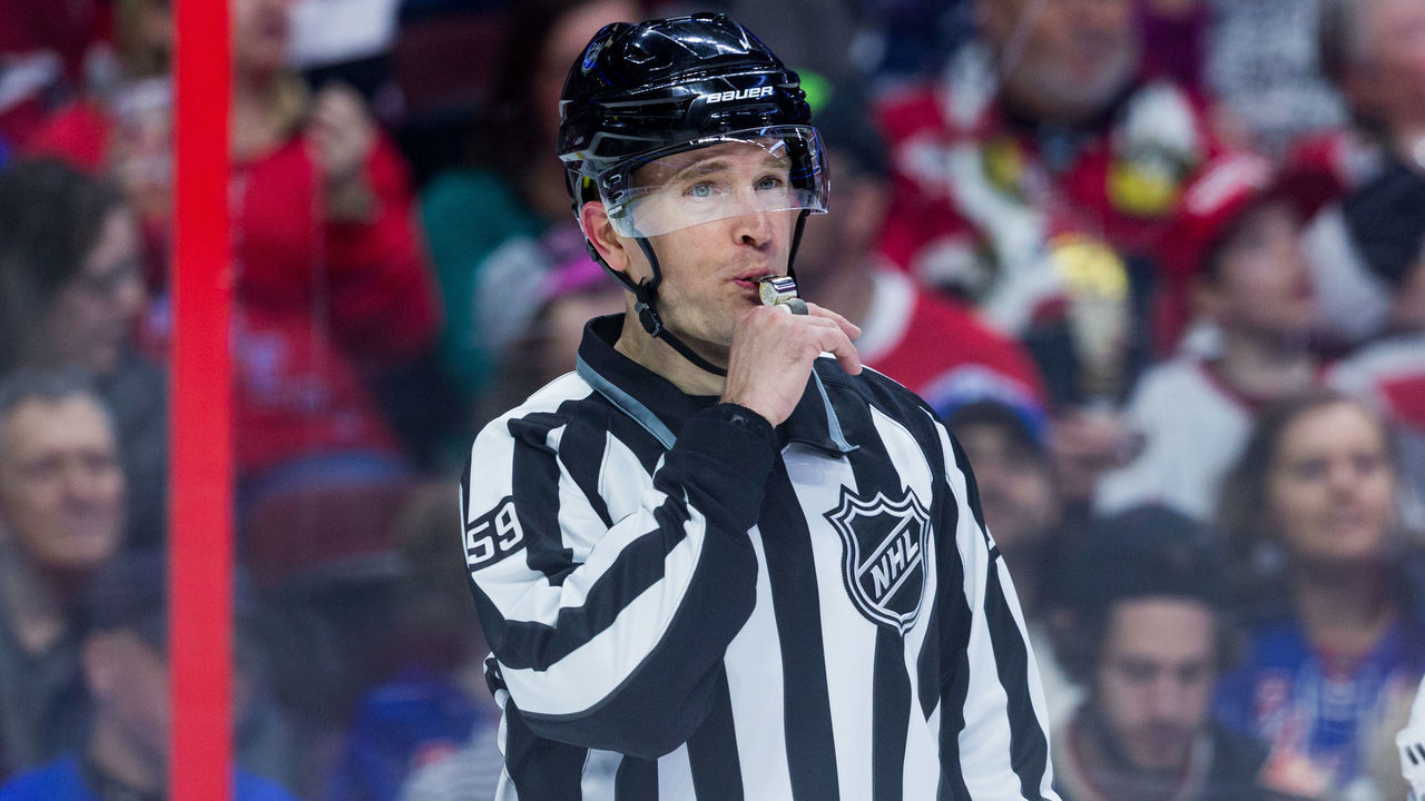 OTTAWA, ON - FEBRUARY 17: Linesmen Steve Barton (59) blows his whistle to call for the face-off during second period National Hockey League action between the New York Rangers and Ottawa Senators on February 17, 2018, at Canadian Tire Centre in Ottawa, ON, Canada.