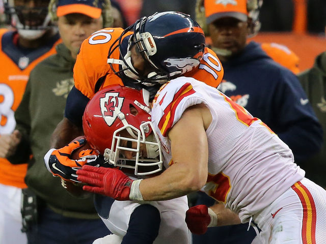DENVER, CO - NOVEMBER 15: Daniel Sorensen #49 of the Kansas City Chiefs puts a hit on Emmanuel Sanders #10 of the Denver Broncos and breaks up a pass play in the third quarter at Sports Authority Field at Mile High on November 15, 2015 in Denver, Colorado. The Chiefs defeated the Broncos 29-13.