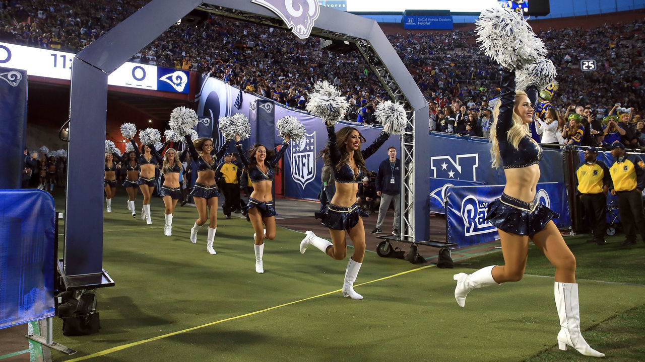 LOS ANGELES, CA - JANUARY 06: The Los Angeles Rams Cheerleaders run onto the field prior to the NFC Wild Card Playoff Game against the Atlanta Falcons at the Los Angeles Coliseum on January 6, 2018 in Los Angeles, California.