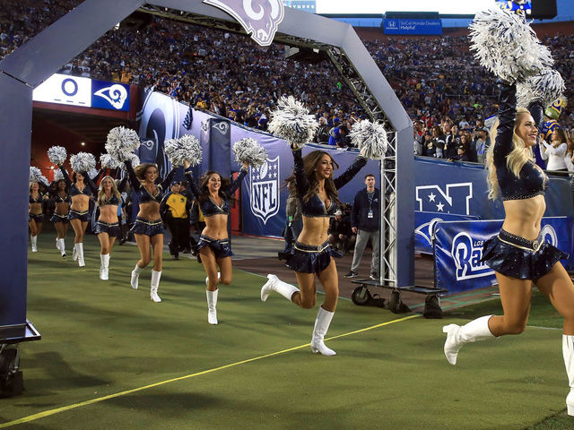 LOS ANGELES, CA - JANUARY 06: The Los Angeles Rams Cheerleaders run onto the field prior to the NFC Wild Card Playoff Game against the Atlanta Falcons at the Los Angeles Coliseum on January 6, 2018 in Los Angeles, California.