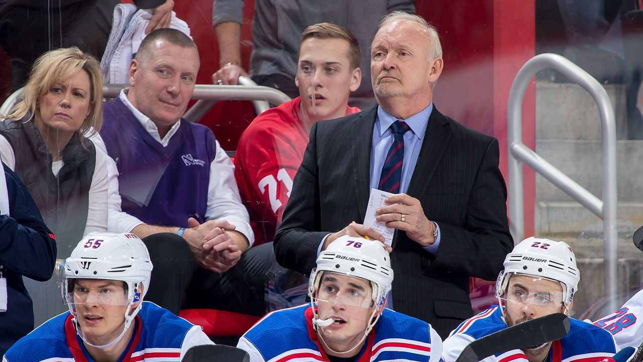DETROIT, MI - DECEMBER 29: Assistant coach Lindy Ruff of the New York Rangers watches the action from the bench against the Detroit Red Wings during an NHL game at Little Caesars Arena on December 29, 2017 in Detroit, Michigan. The Wings defeated the Rangers 3-2 in a shootout.