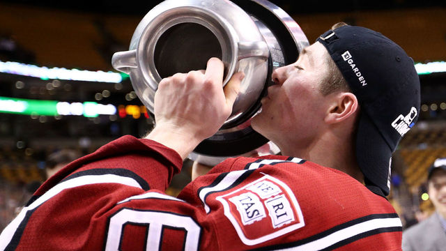 BOSTON, MA - FEBRUARY 13: Ryan Donato #16 of the Harvard Crimson kisses the Beanpole Trophy after defeating Boston University Terriers 6-3 in the 2017 Beanpot Tournament Championship at TD Garden on February 13, 2017 in Boston, Massachusetts.