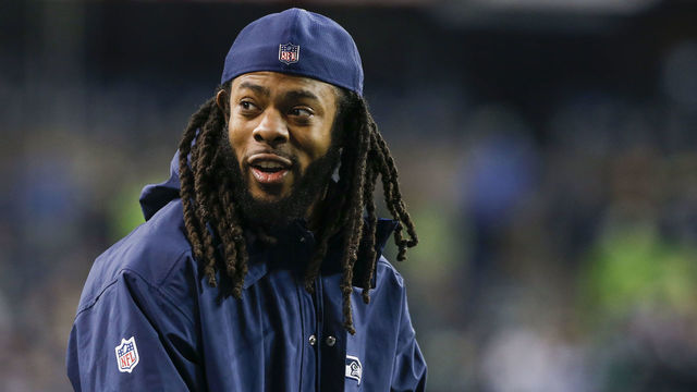 SEATTLE, WA - DECEMBER 03: Injured cornerback Richard Sherman of the Seattle Seahawks smiles from the sidelines before the game against the Philadelphia Eagles at CenturyLink Field on December 3, 2017 in Seattle, Washington.