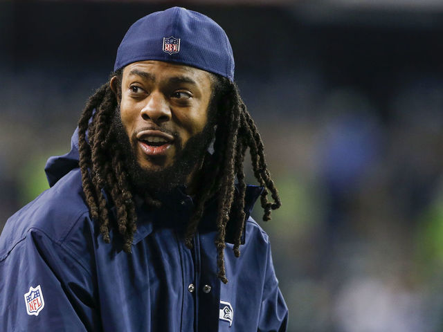 SEATTLE, WA - DECEMBER 03: Injured cornerback Richard Sherman of the Seattle Seahawks smiles from the sidelines before the game against the Philadelphia Eagles at CenturyLink Field on December 3, 2017 in Seattle, Washington.