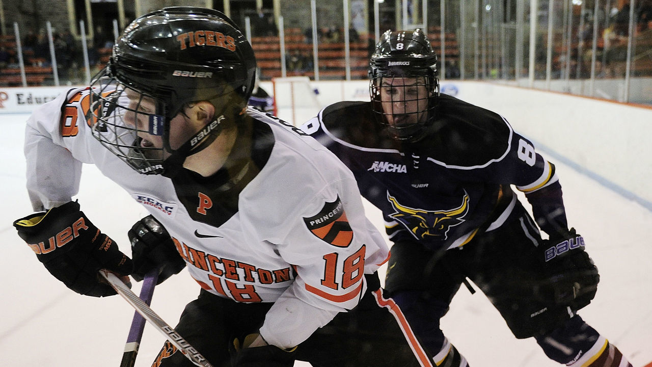 PRINCETON, NJ - DECEMBER 16: Eric Robinson #18 of the Princeton Tigers is followed by Daniel Brickley #8 of the Minnesota State Mavericks during the first period at Hobey Baker Rink on December 16, 2016 in Princeton, New Jersey.