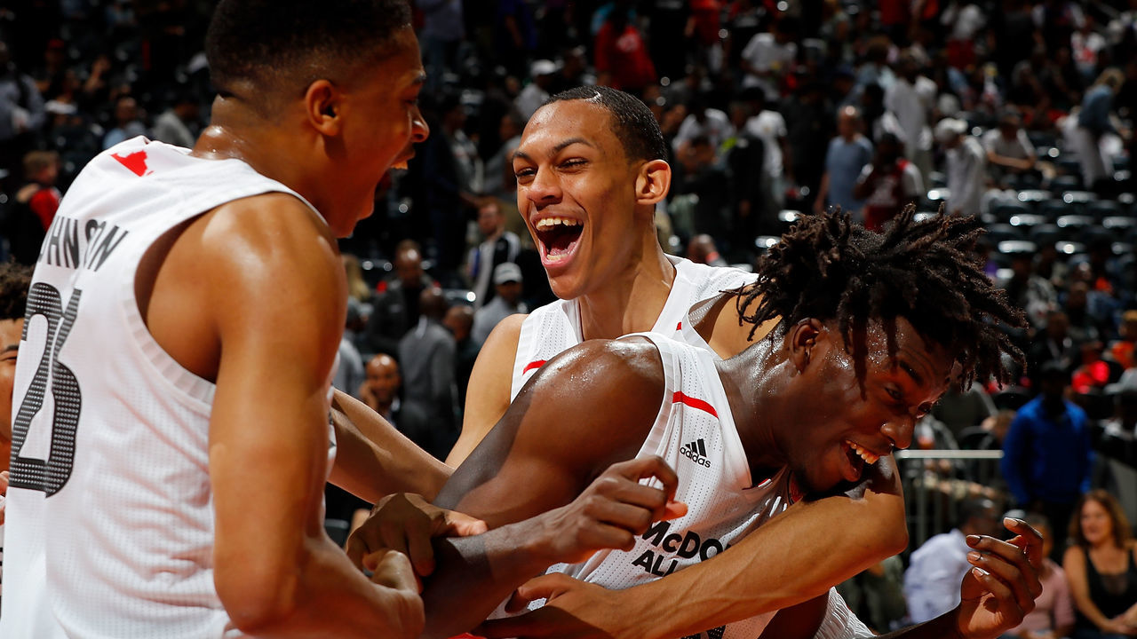 ATLANTA, GA - MARCH 28: Nassir Little #10 of Orlando Christian Prep is congratulated by teammates Keldon Johnson #23 of Oak Hill Academy and Darius Bazley #15 of Princeton High School after he won the MVP trophy in the 2018 McDonald's All American Game at Philips Arena on March 28, 2018 in Atlanta, Georgia.