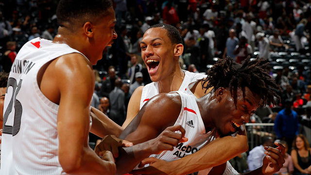 ATLANTA, GA - MARCH 28: Nassir Little #10 of Orlando Christian Prep is congratulated by teammates Keldon Johnson #23 of Oak Hill Academy and Darius Bazley #15 of Princeton High School after he won the MVP trophy in the 2018 McDonald's All American Game at Philips Arena on March 28, 2018 in Atlanta, Georgia.