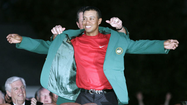 AUGUSTA, UNITED STATES: US golfer Tiger Woods is presented the green jacket by last year's winner Phil Mickelson of the US 10 April 2005 after Woods won the 2005 Masters Golf Tournament at the Augusta National Golf Club in Augusta, Georgia. Woods beat fellow American Chris DiMarco in a one-hole playoff. AFP PHOTO/Timothy A. CLARY