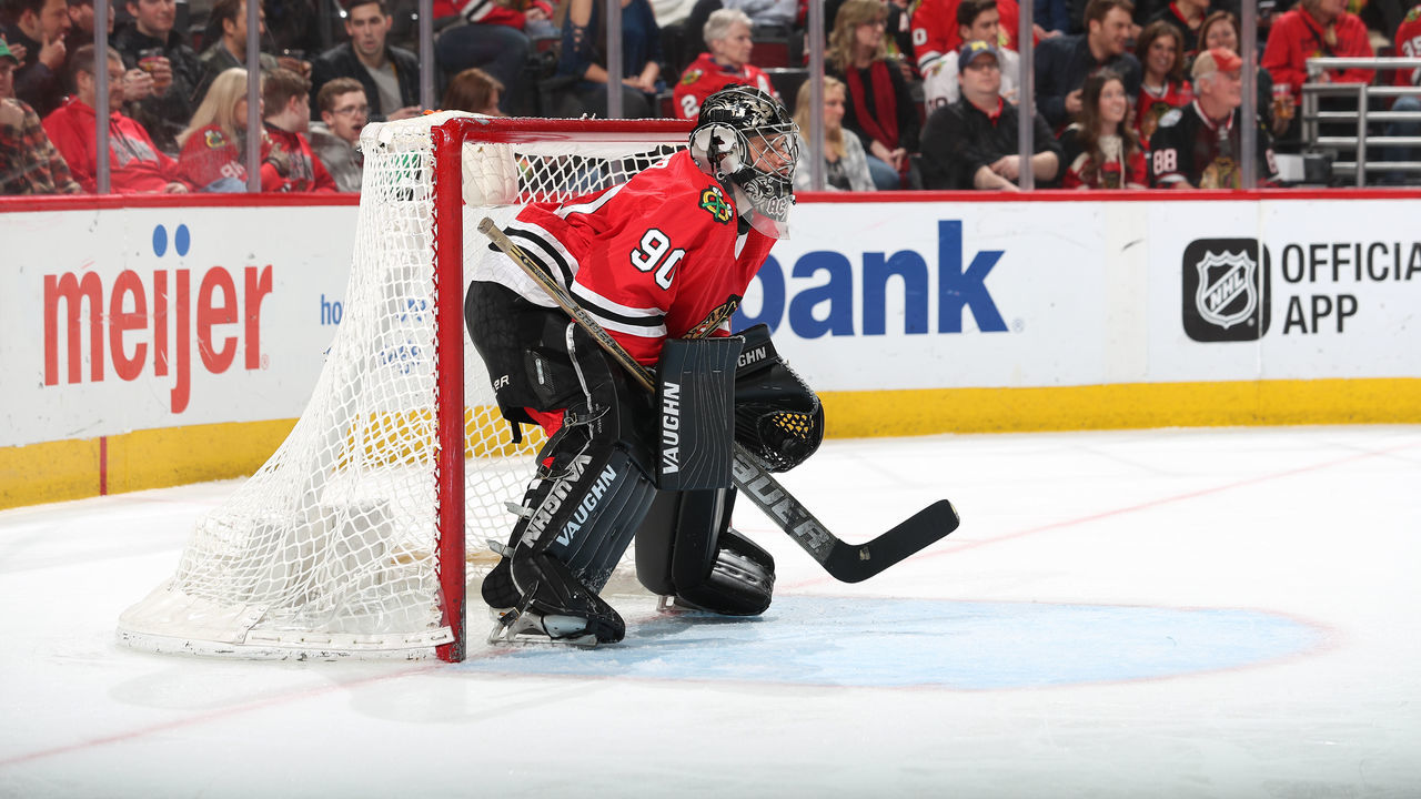 CHICAGO, IL - MARCH 29: Goalie Scott Foster #90 of the Chicago Blackhawks guards the net in the third period against the Winnipeg Jets at the United Center on March 29, 2018 in Chicago, Illinois.