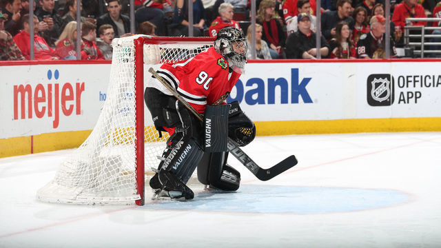 CHICAGO, IL - MARCH 29: Goalie Scott Foster #90 of the Chicago Blackhawks guards the net in the third period against the Winnipeg Jets at the United Center on March 29, 2018 in Chicago, Illinois.