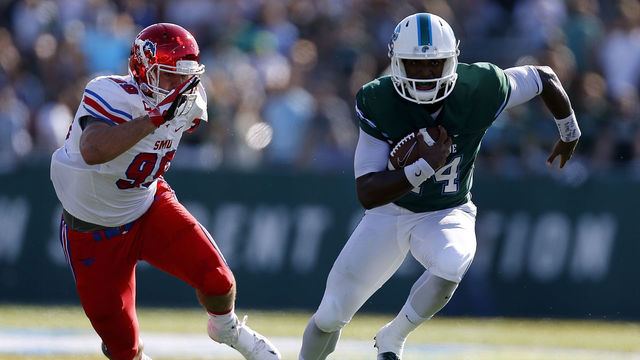 NEW ORLEANS, LA - OCTOBER 29: Glen Cuiellette #14 of the Tulane Green Wave runs past Justin Lawler #99 of the Southern Methodist Mustangs during the first half of a game at Yulman Stadium on October 29, 2016 in New Orleans, Louisiana.