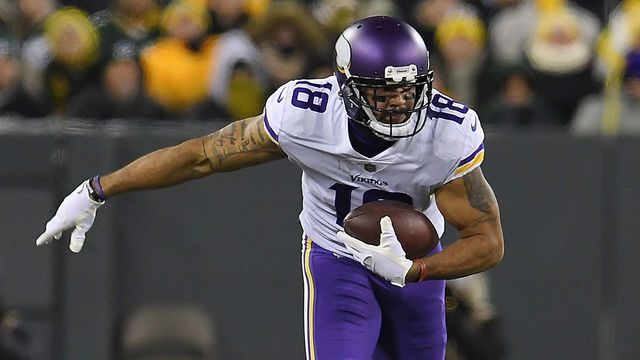 GREEN BAY, WI - DECEMBER 23: Michael Floyd #18 of the Minnesota Vikings is brought down by Josh Jones #27 of the Green Bay Packers during the second quarter of a game at Lambeau Field on December 23, 2017 in Green Bay, Wisconsin.
